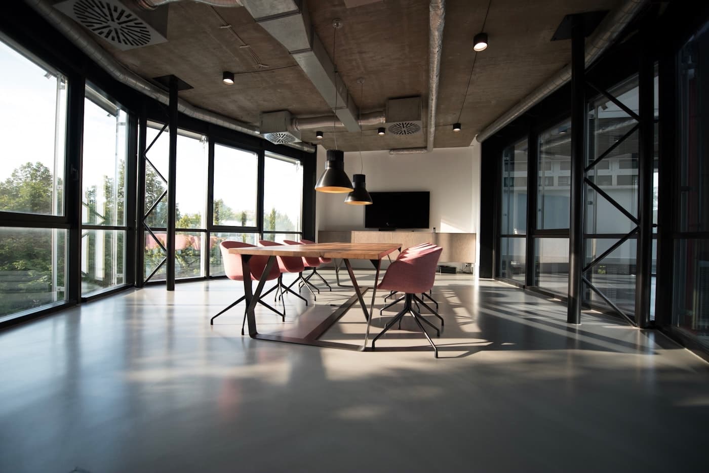 Sunlit boardroom prepared for a private leadership discussion.